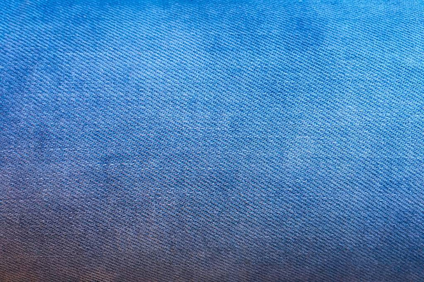 Μπλε φόντο, φόντο τζιν τζιν. Τζιν υφή, ύφασμα από βαμβακερό denim - Φωτογραφία, εικόνα
