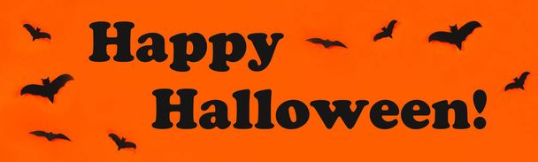 The concept for Halloween. Bats on an orange background. - Foto, Imagem