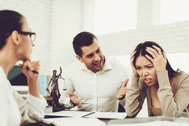 Upset Husband and Angry Wife in Office with Lawyer. Frustrated Husband. Problem in Relationship between People. Modern Law Office. Angry Young Wife. Marriage Problem. Young Advocate. - Фото, зображення