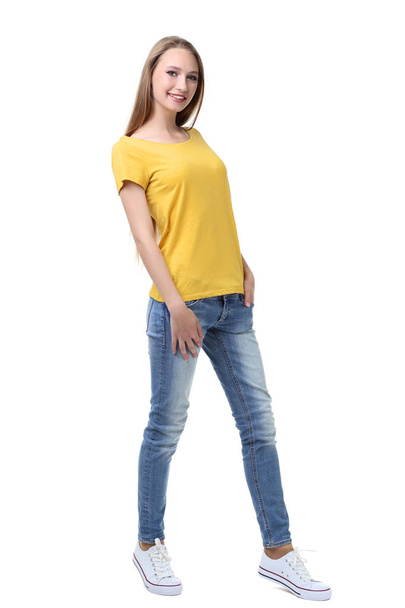 Portrait of young woman in yellow t-shirt on white background - Photo, image