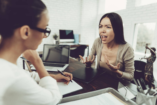 Young Upset Woman in Office with Lawyer in Glasses. Frustrated Woman. Problem in Relationship between People. Modern Law Office. Angry Young Woman. Marriage Problem. Young Advocate. - Foto, Bild
