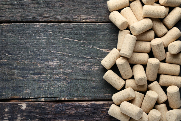 Wine corks on grey wooden table - Фото, изображение