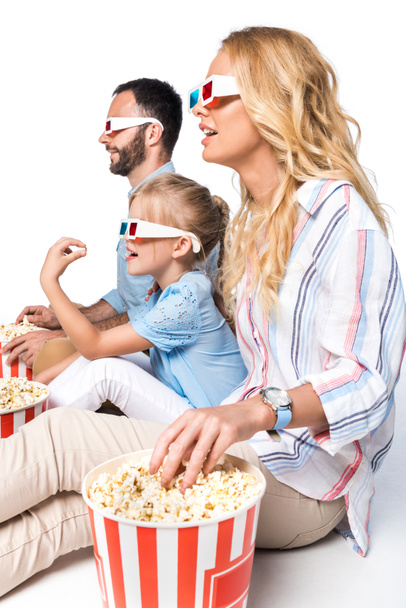 side view of family with popcorn and 3d glasses isolated on white - Photo, Image