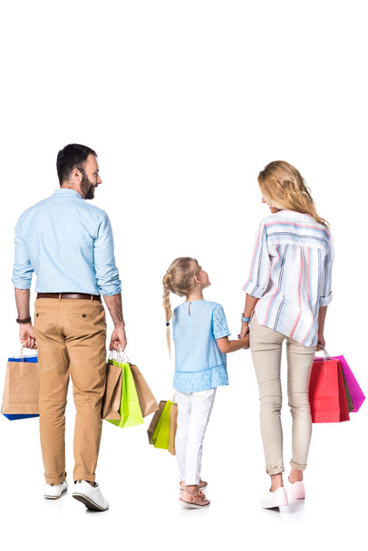 back view of family with shopping bags isolated on white - Foto, Imagem
