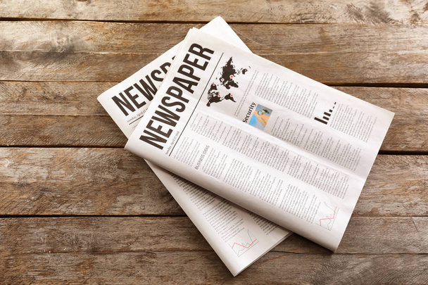 Newspapers on wooden background - Photo, Image