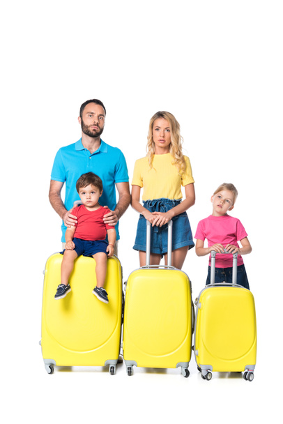 front view of family with yellow suitcases isolated on white - Foto, afbeelding