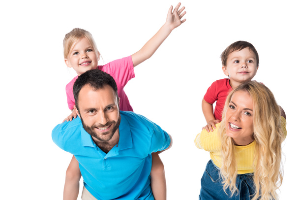 happy parents piggybacking kids isolated on white - Foto, immagini