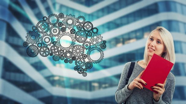 Creative student woman holding a red book and think. Gear hologram, cog wheels arranged in shape of brain. Future technology artificial intelligence. Human logic and emotions concept. - Photo, Image