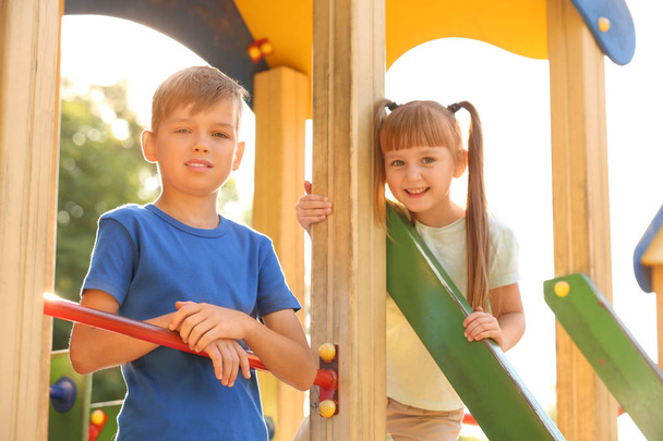 Cute little children outdoors on playground - Φωτογραφία, εικόνα