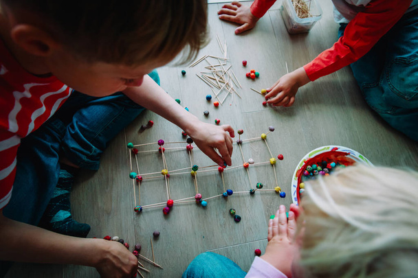 kids making geometric shapes from sticks and play dough - Fotoğraf, Görsel