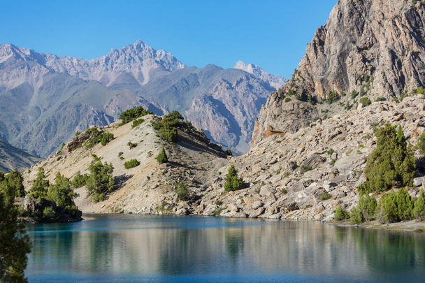 Beautiful serene lake in  Fanns mountains (branch of Pamir) in Tajikistan. - Φωτογραφία, εικόνα