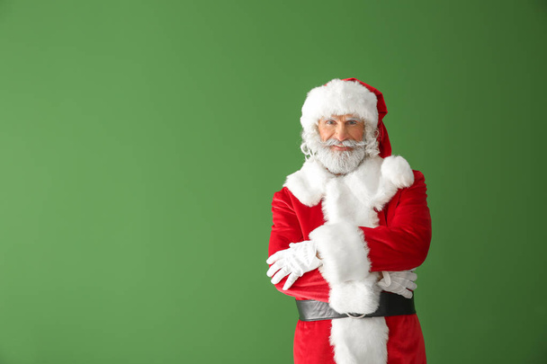 Portrait of Santa Claus on color background - Фото, изображение
