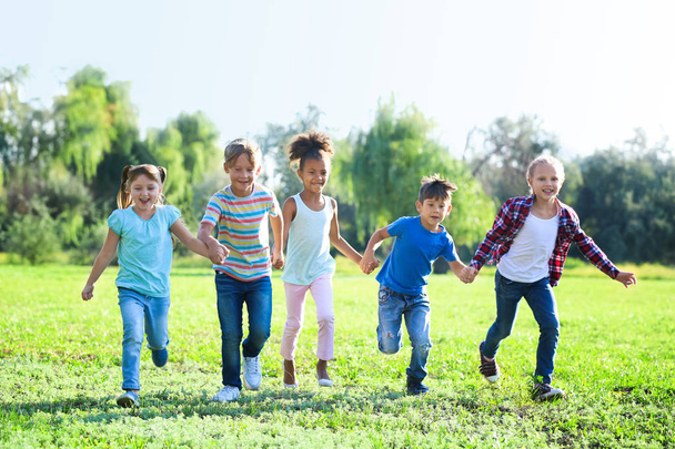 Cute little children playing outdoors - Φωτογραφία, εικόνα