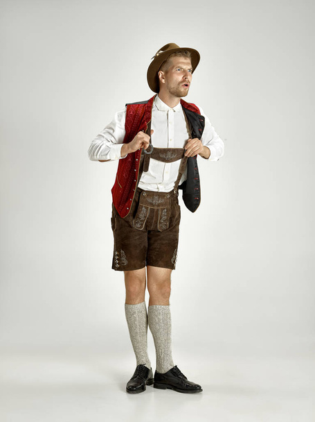 Portrait of Oktoberfest man, wearing a traditional Bavarian clothes - 写真・画像