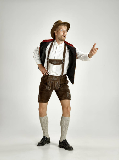 Portrait of Oktoberfest man, wearing a traditional Bavarian clothes - Photo, image