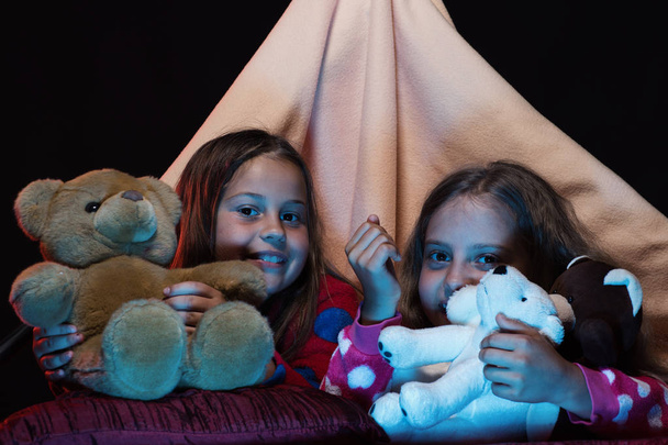 Girls with happy faces playing with teddies in tent - Foto, Bild