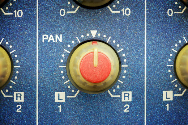 left to right red pan knob on a blue mixing table, close up view - Photo, Image