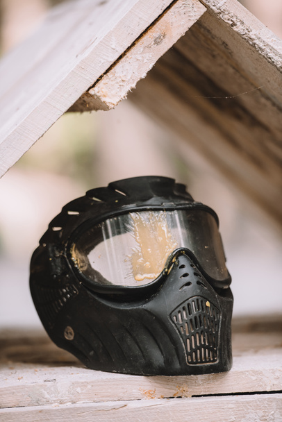 selective focus of protective mask covered by paintball splash outdoors  - Foto, immagini