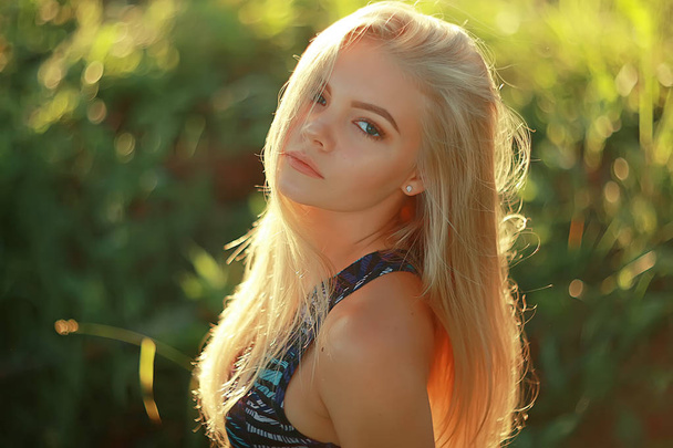 beautiful young woman wearing sportswear in summer park, jogging and sport concept  - Fotografie, Obrázek