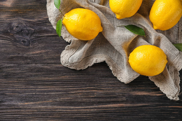 Whole ripe lemons on wooden table - Photo, image