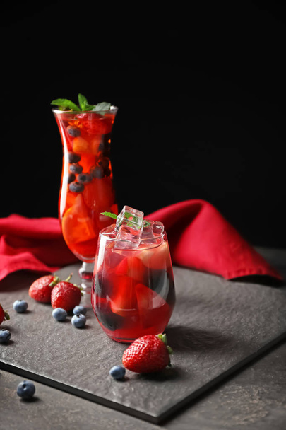 Fresh summer cocktails in glasses on grey table - Fotoğraf, Görsel