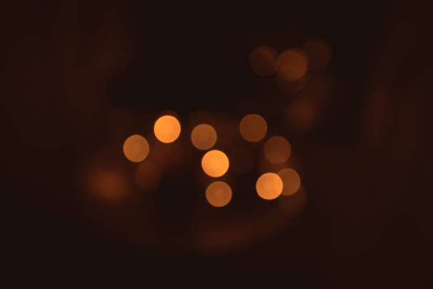 Bokeh lights in warm colors in the Christmas holidays in Decemeber - Photo, Image