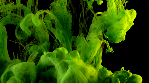 Colorful green paint mixing in water. Cloud of silky olive ink swirling underwater. Abstract smoke explosion can be used as transitions, added to modern projects, art backgrounds - Footage, Video