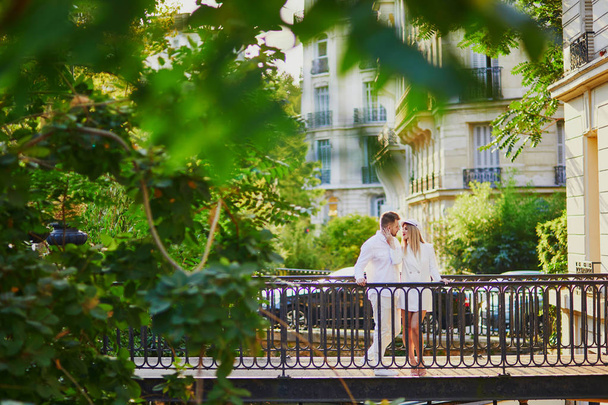 Romantic couple having a date in Paris. Tourists in France enjoying the city - Fotó, kép