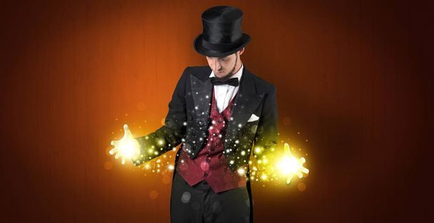 Illusionist holding superpower on his hand - Photo, Image