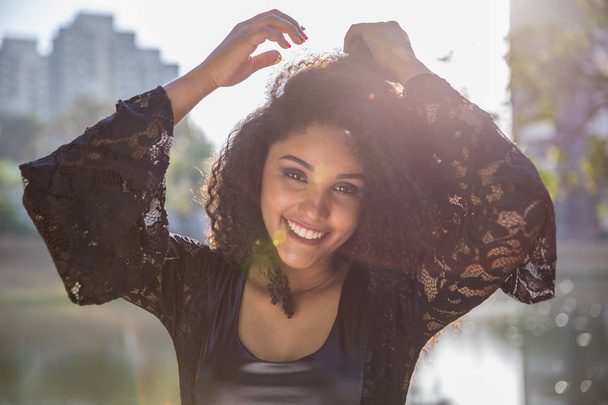 Portrait of smiling young black woman - Fotografie, Obrázek