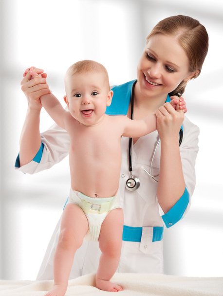 Pediatrician woman doctor holding baby - Photo, Image