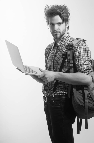 Handsome man or traveler with backpack and laptop - Photo, Image