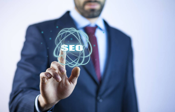 Business man touching  SEO text on screen - Photo, Image