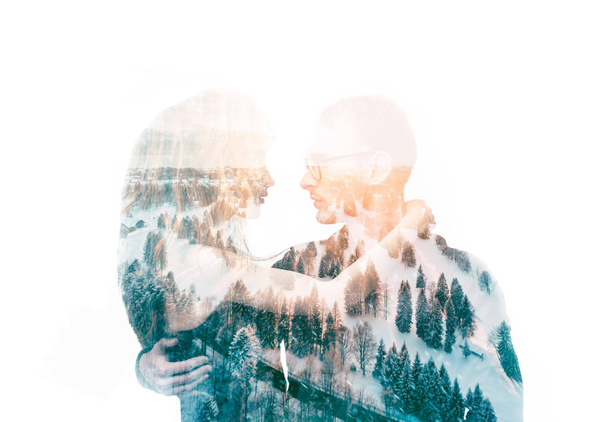Double exposure portrait of a couple looking at each other with love and passion, embracing. Combined with photograph of winter landscape. Romance and people concept. Unity human and nature. Isolated on white - Foto, immagini