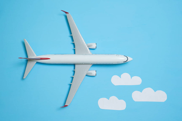 white airplane on a blue - Φωτογραφία, εικόνα
