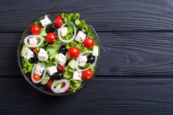 Fresh vegetables greek salad . Healthy food on wooden background - Foto, immagini