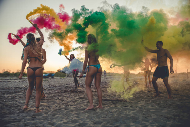 Happy group of friends celebrating and having fun on the beach - Young people on summer holiday - Φωτογραφία, εικόνα