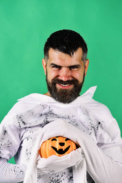 Man with evil smile isolated on green background. Halloween character - Фото, зображення