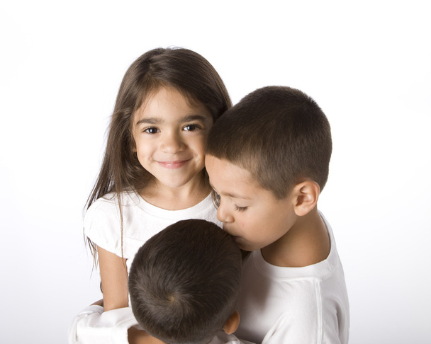 Portrait of hispanic siblings hugging - Foto, Bild