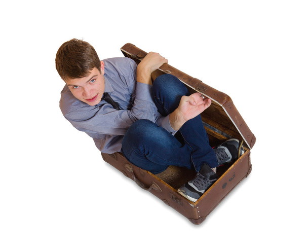 Man sitting inside old suitcase - Fotoğraf, Görsel