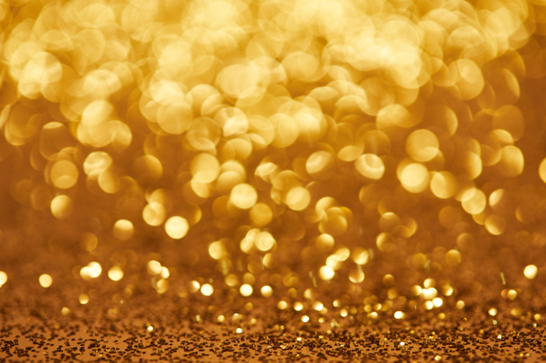 golden bokeh christmas background with glittering sequins - Foto, Imagem