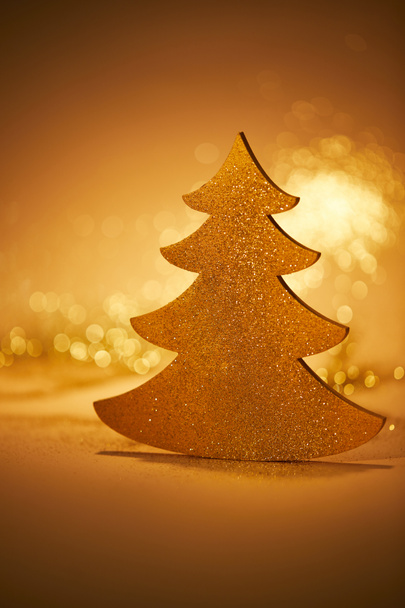 golden glittering christmas tree for decoration on tabletop - Photo, Image