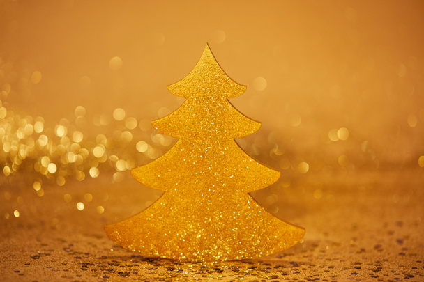 golden glittering christmas tree for decoration - Foto, afbeelding