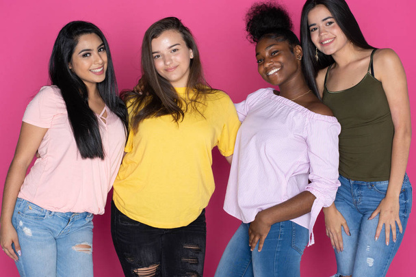 Group of diverse teen together on a pink background - Fotografie, Obrázek