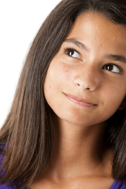 Hispanic teen girl looking up with a smile - Foto, Imagen