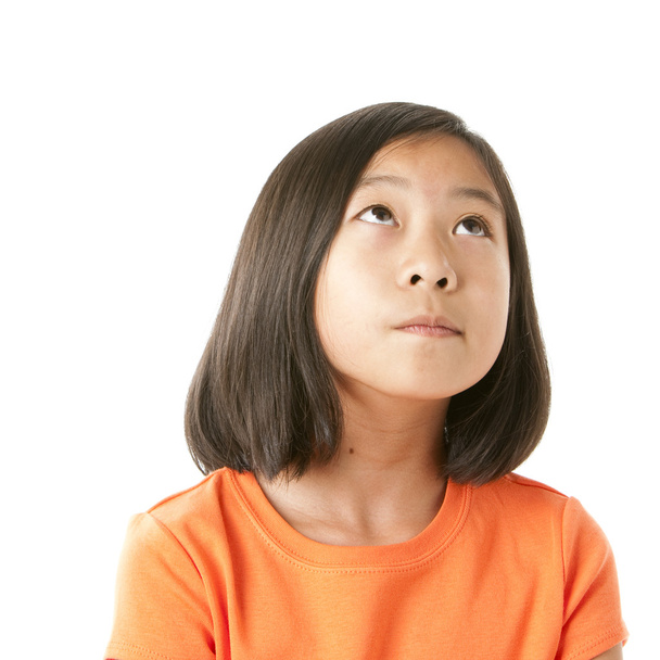 Asian girl looking up in wonder or with hope - Photo, image