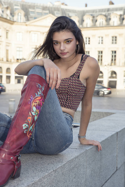 Street fashion concept. Portrait of elegant young beautiful woman. Paris buildings as background. - Photo, Image