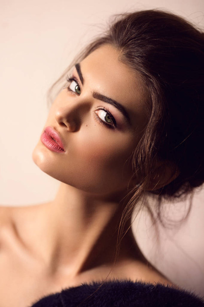 Portrait of beautiful young brunette woman with make up - Fotografie, Obrázek