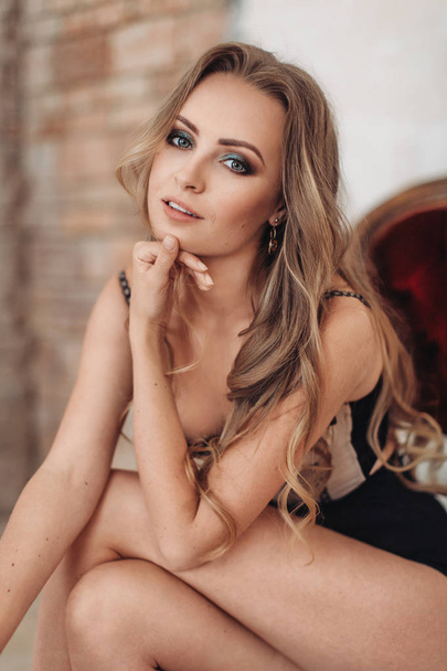 Beautiful young woman posing in  sexy lingerie in studio  - Фото, зображення