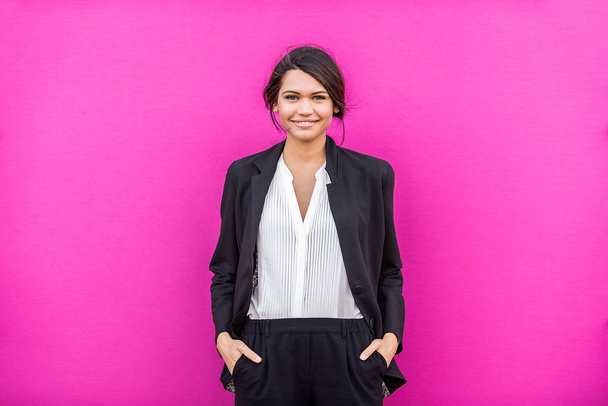 Beautiful businesswoman on colored background - Pretty young adult female portrait - 写真・画像